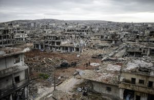 A photo taken on January 30, 2015 shows the eastern part of the destroyed Syrian town of Kobane, also known as Ain al-Arab. Kurdish forces recaptured the town on the Turkish frontier on January 26, in a symbolic blow to the jihadists who have seized large swathes of territory in their onslaught across Syria and Iraq.     AFP PHOTO/BULENT KILICBULENT KILIC/AFP/Getty Images           NYTCREDIT: Bulent Kilic/Agence France-Presse -- Getty Images